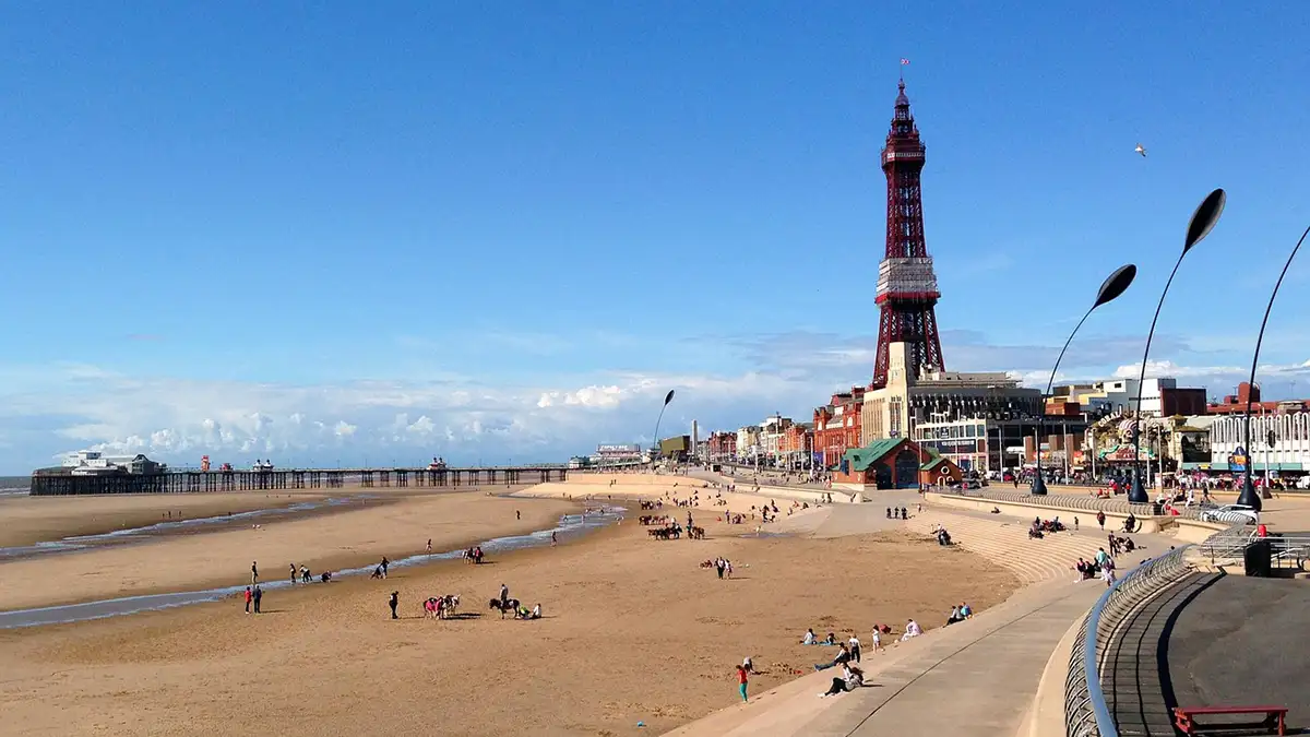 Blackpool beach with the Blackpool Tower in the background on a sunny day